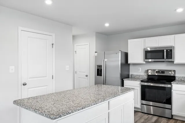 a bathroom with a sink a mirror and shower