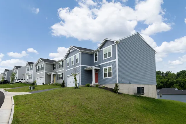 a view of an house with backyard porch and garden