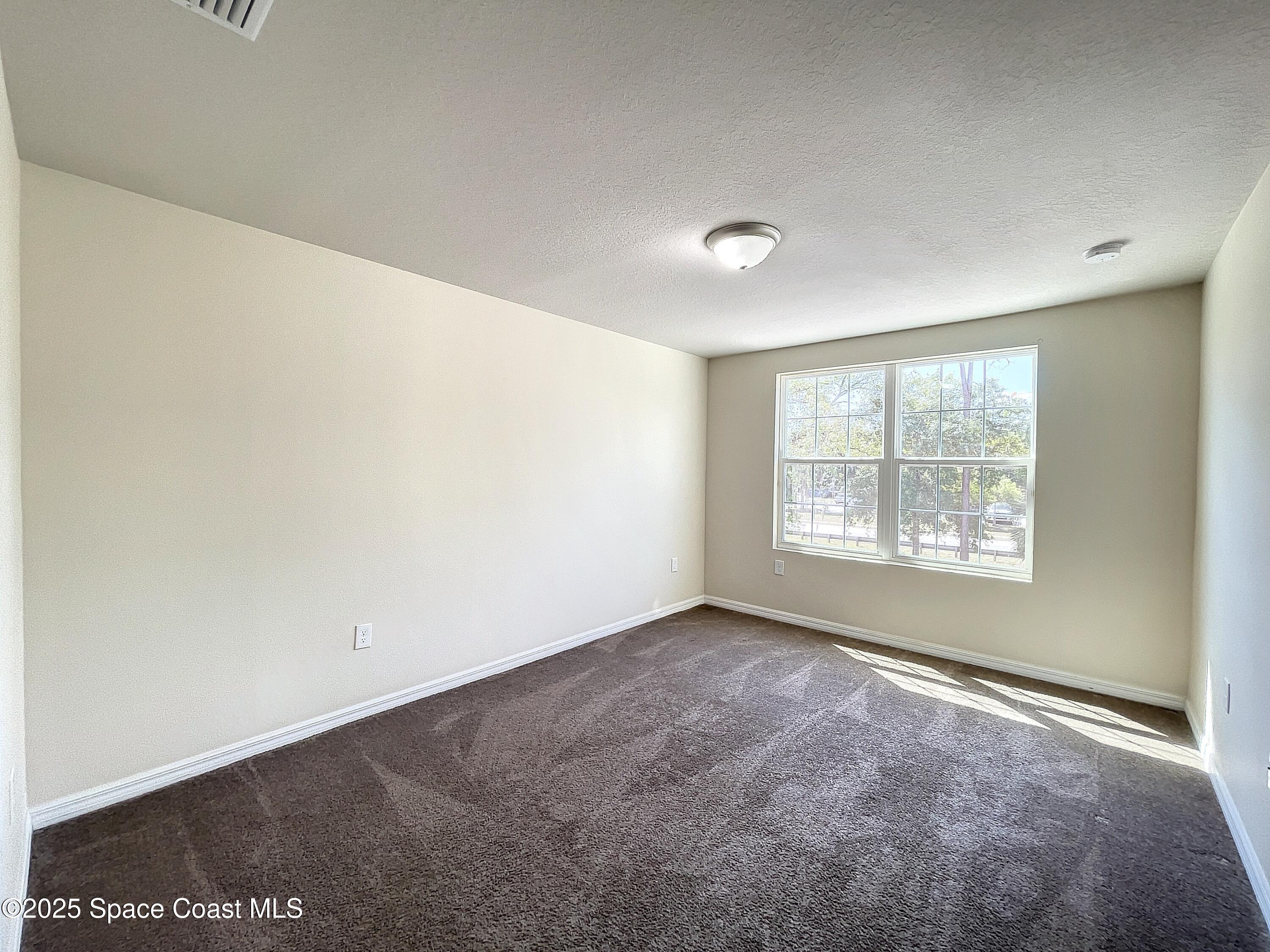 3737 Chambers Lane, Unit 8 Cocoa, FL 32926 - Photo 12 of 24 an empty room with windows