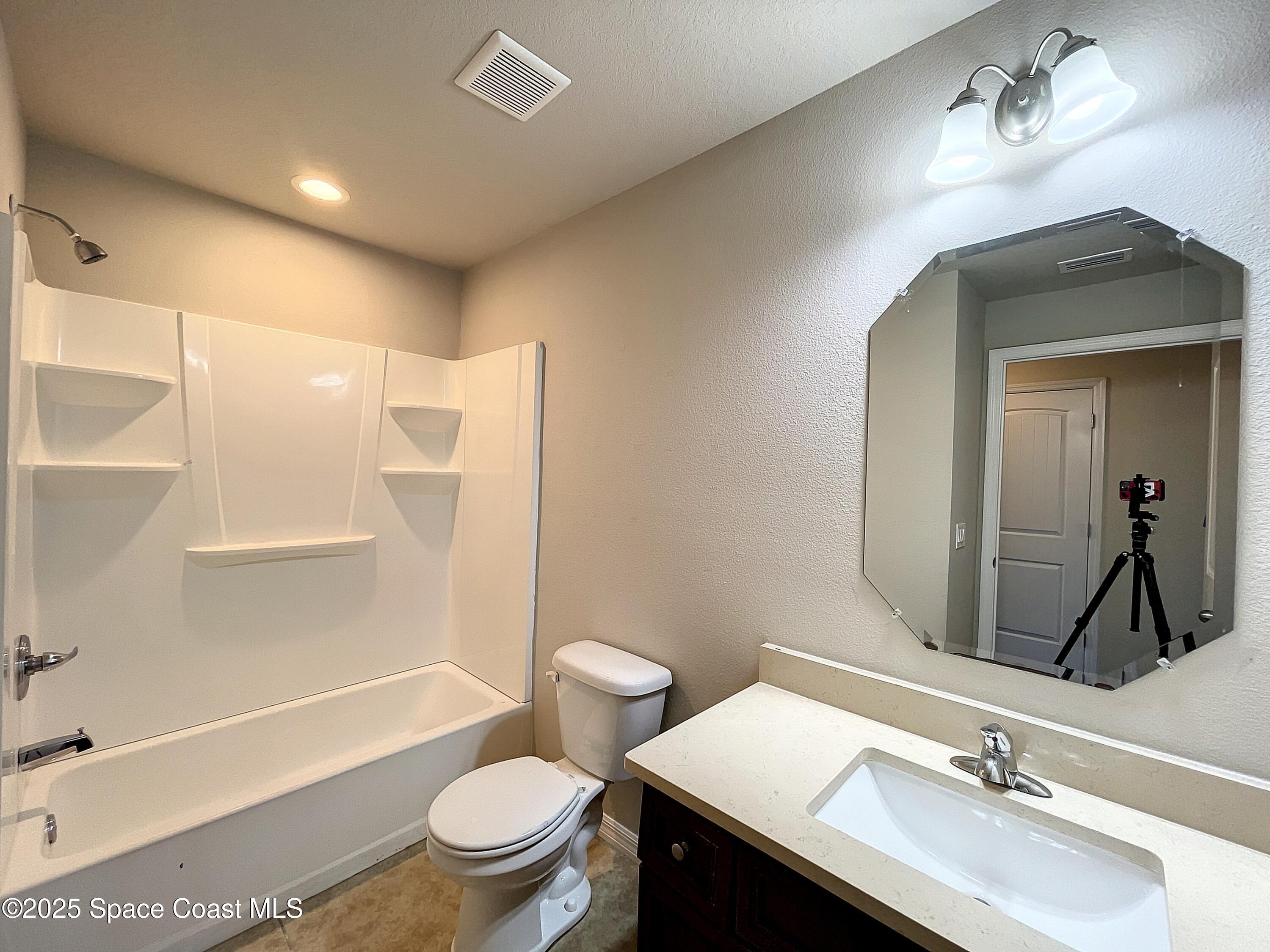 3737 Chambers Lane, Unit 8 Cocoa, FL 32926 - Photo 21 of 24 a bathroom with a sink a toilet and shower