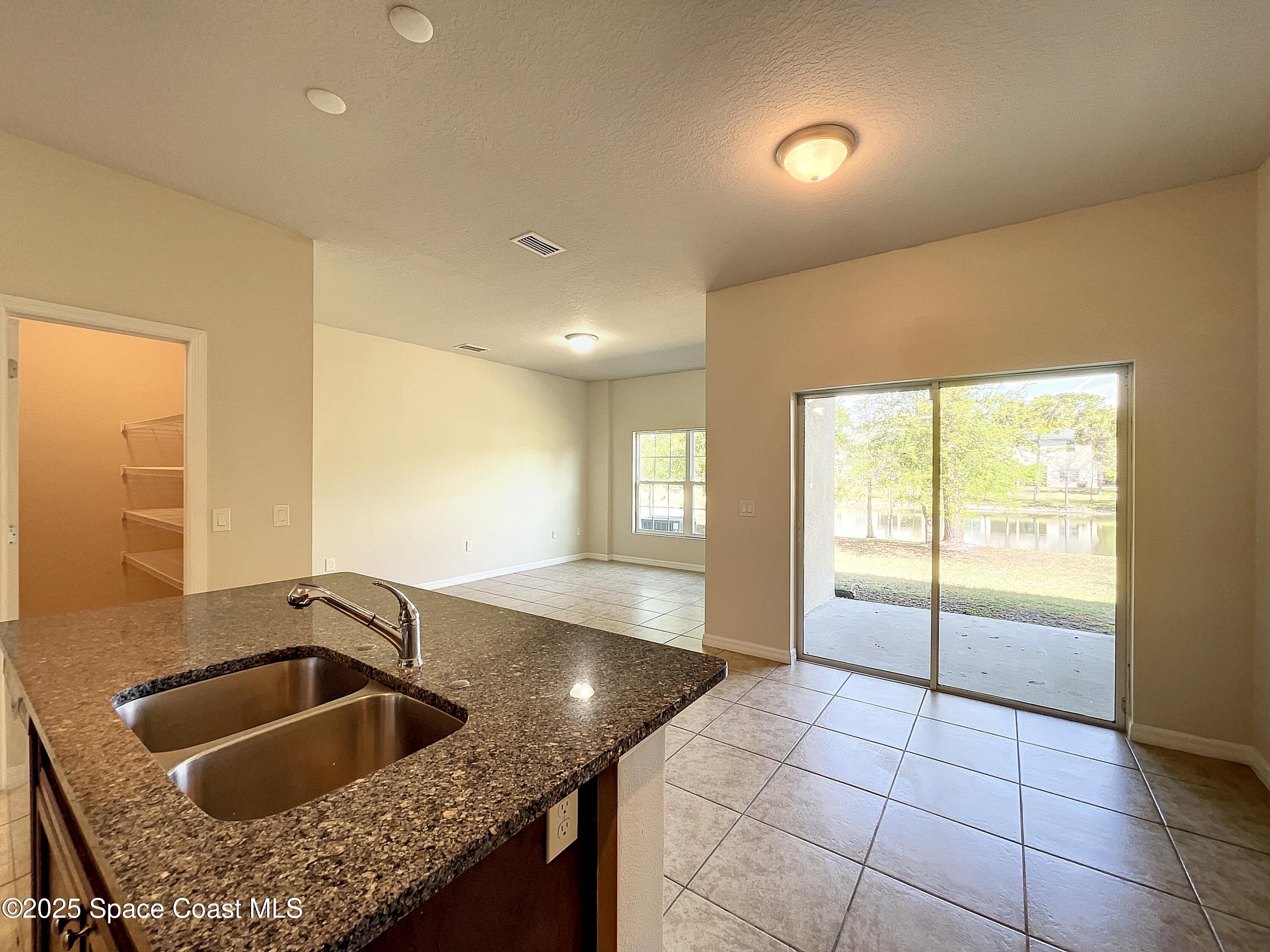 3737 Chambers Lane, Unit 8 Cocoa, FL 32926 - Photo 8 of 24 a kitchen with a sink and a window