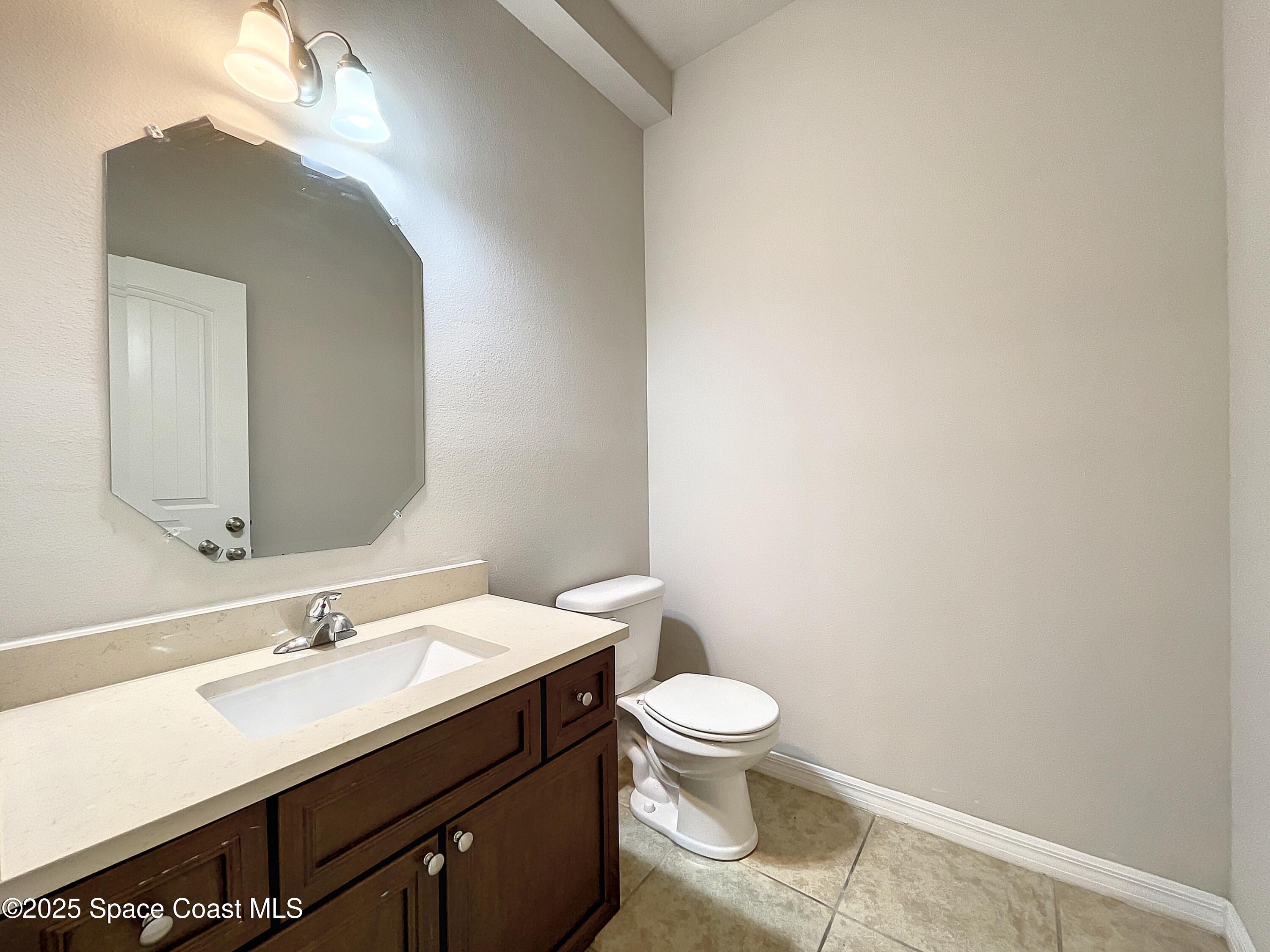 3737 Chambers Lane, Unit 8 Cocoa, FL 32926 - Photo 10 of 24 a bathroom with a sink vanity and a toilet