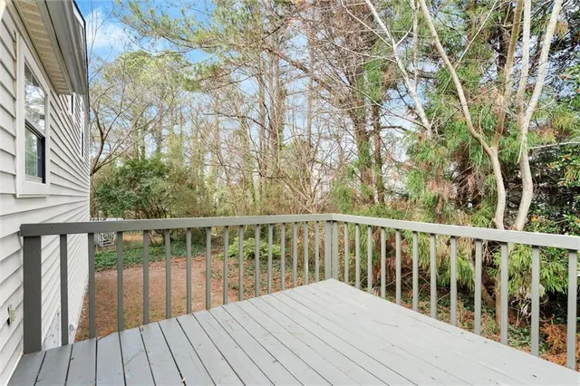 a view of balcony with wooden floor