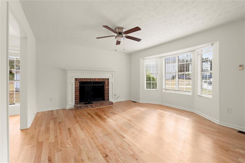 5984 Brookside Court Southeast Mableton, GA 30126 - Photo 2 of 21 a view of an empty room with window and fire place