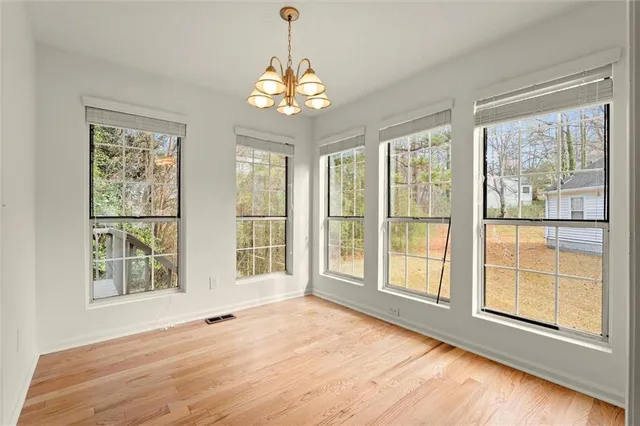 a view of an empty room with a window