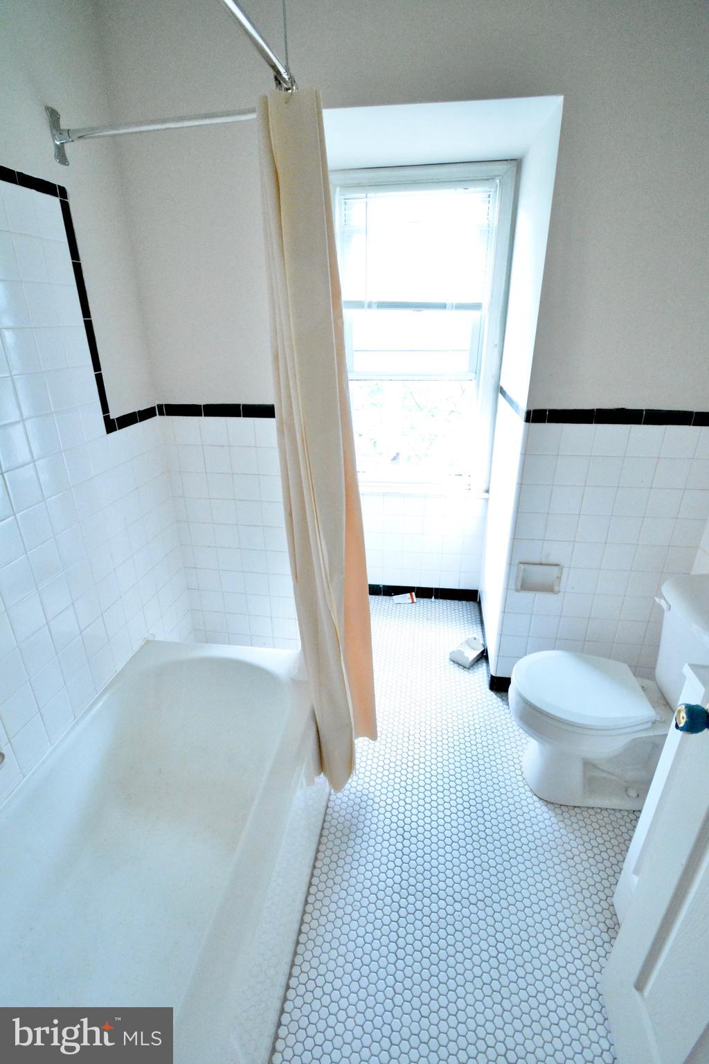 130 Manheim Street, Unit 3 Philadelphia, PA 19144 - Photo 11 of 14 a bathroom with a toilet and a shower
