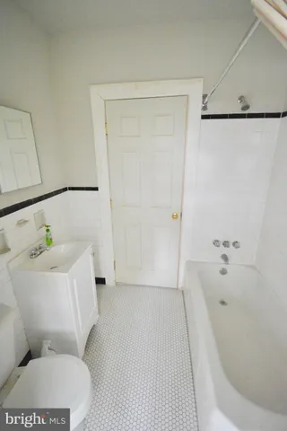 a bathroom with a bathtub and shower