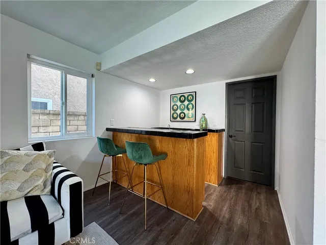 a view of a livingroom with furniture and wooden floor