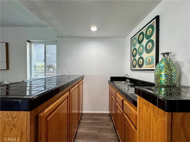 a kitchen with stainless steel appliances granite countertop a stove and a sink