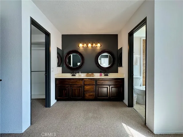 a kitchen with granite countertop a stove and a sink