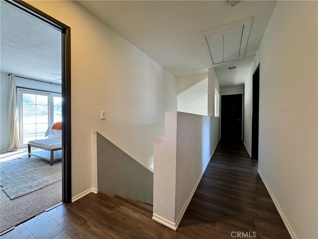 21 North Slope Lane Pomona, CA 91766 - Photo 32 of 48 a view of a hallway view with wooden floor and staircase