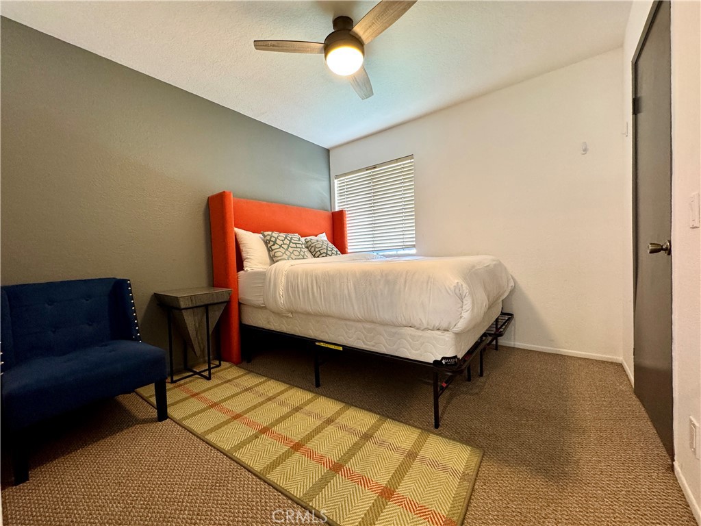 21 North Slope Lane Pomona, CA 91766 - Photo 36 of 48 a bedroom with a bed dresser and a window