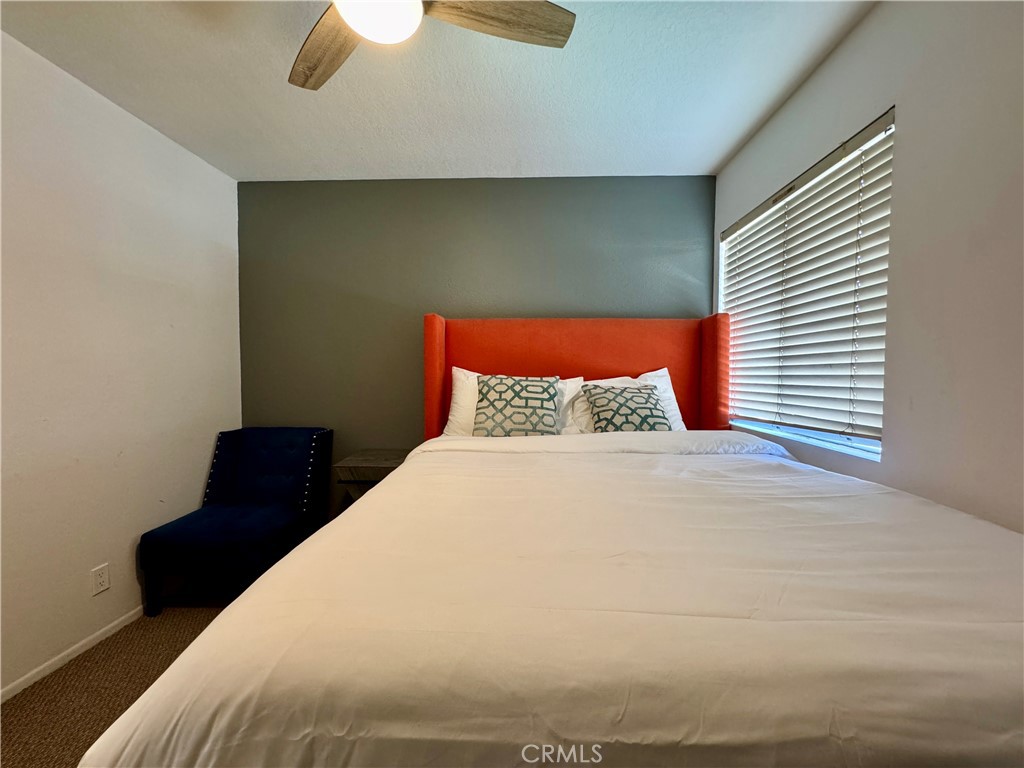 21 North Slope Lane Pomona, CA 91766 - Photo 37 of 48 a large bed sitting in a bedroom next to a window