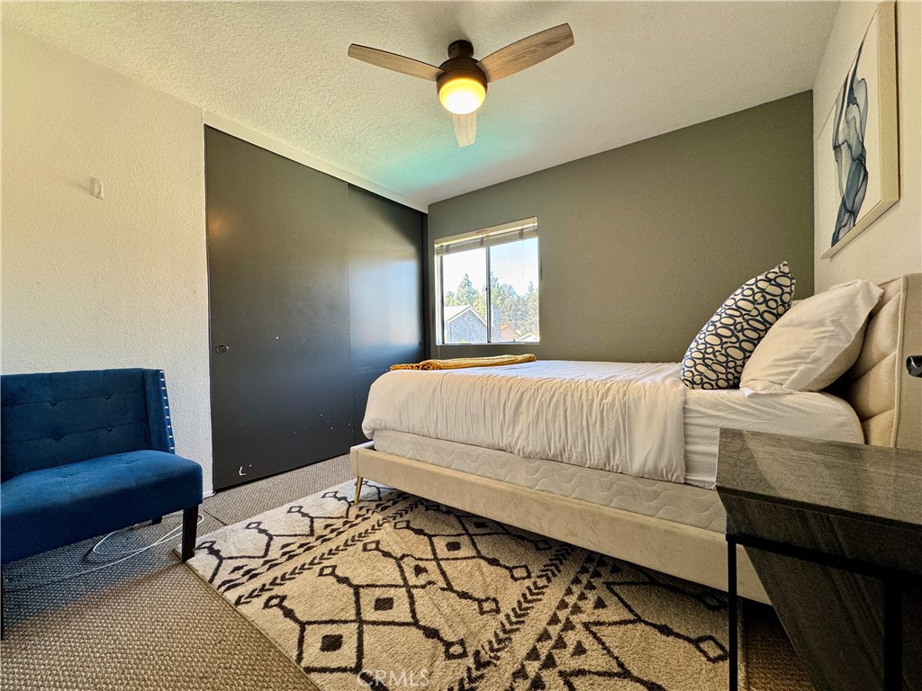 21 North Slope Lane Pomona, CA 91766 - Photo 39 of 48 a bedroom with a bed couch and a window