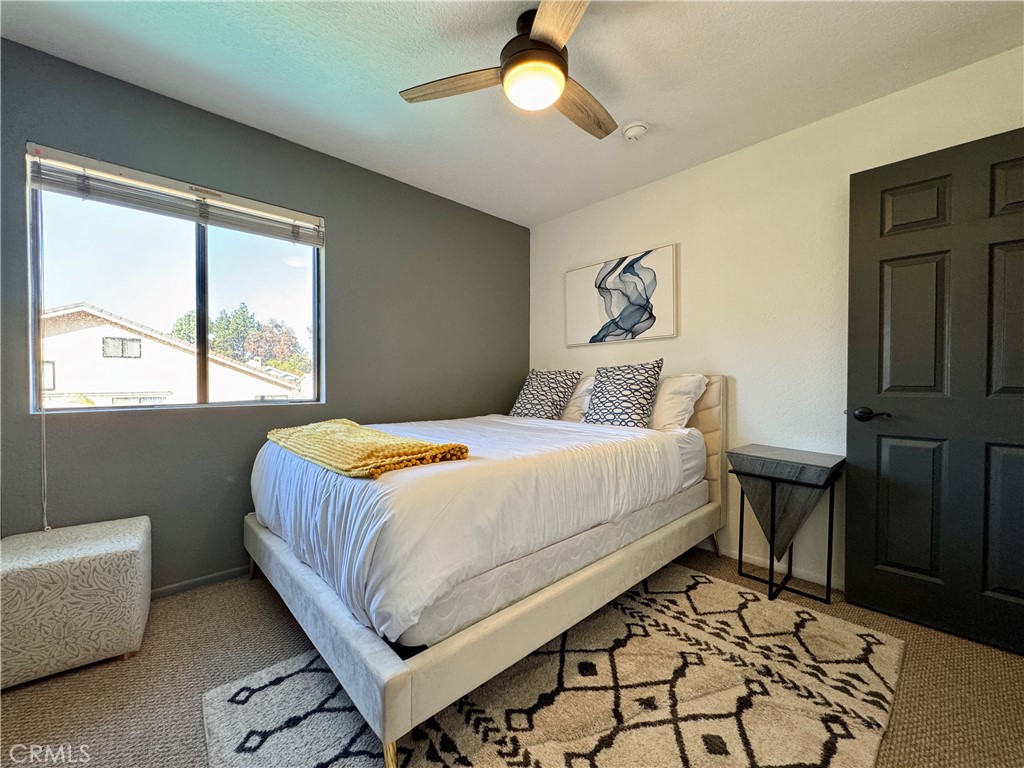 21 North Slope Lane Pomona, CA 91766 - Photo 40 of 48 a bedroom with a bed and wooden floor