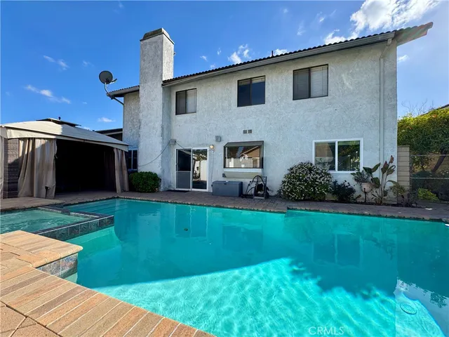 a front view of house with yard and outdoor seating