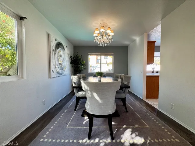 a view of a dining room with furniture and window
