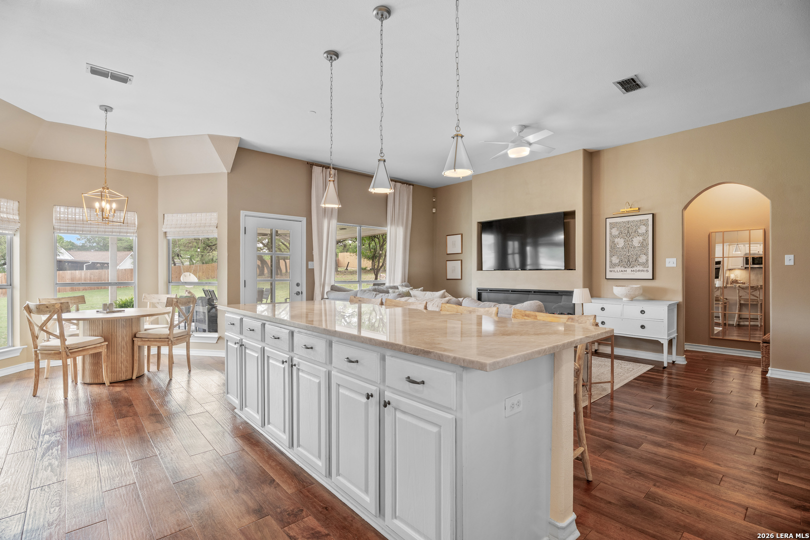 29314 Sumpter Drive Fair Oaks Ranch, TX 78015 - Photo 12 of 44 a large kitchen with lots of counter space a sink appliances and living room view