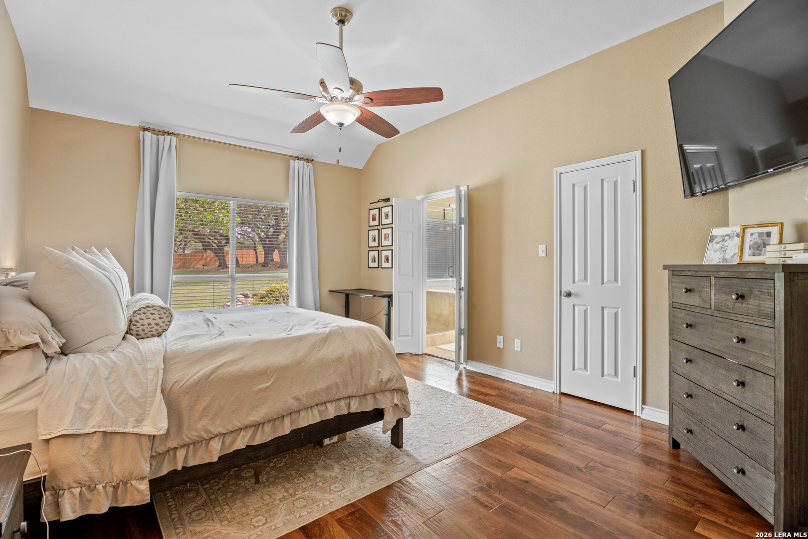 29314 Sumpter Drive Fair Oaks Ranch, TX 78015 - Photo 20 of 44 a bedroom with a bed and wooden floor