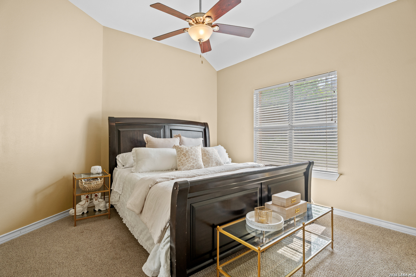 29314 Sumpter Drive Fair Oaks Ranch, TX 78015 - Photo 26 of 44 a bedroom with a bed and a chandelier