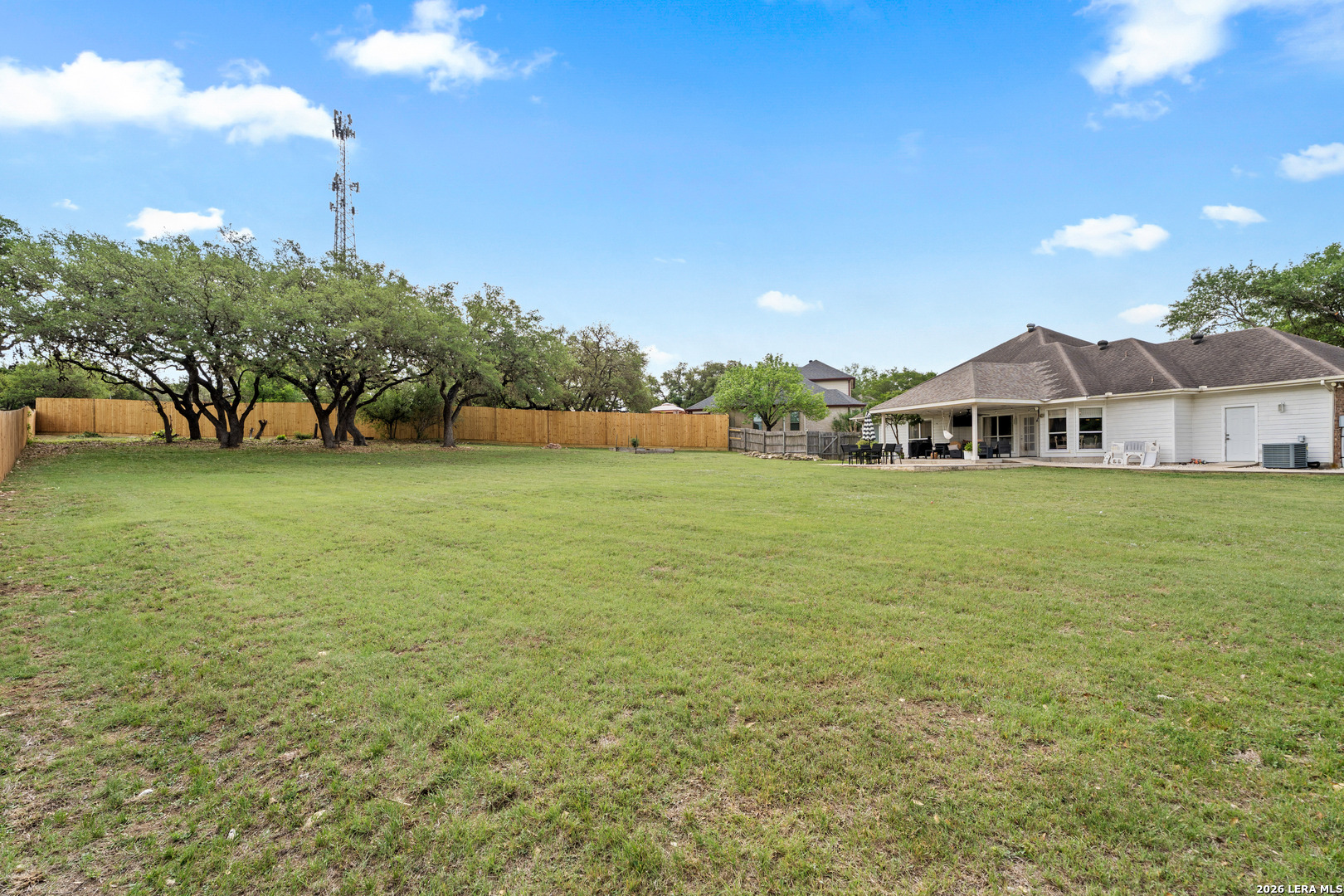 29314 Sumpter Drive Fair Oaks Ranch, TX 78015 - Photo 34 of 44 a view of a house with a big yard