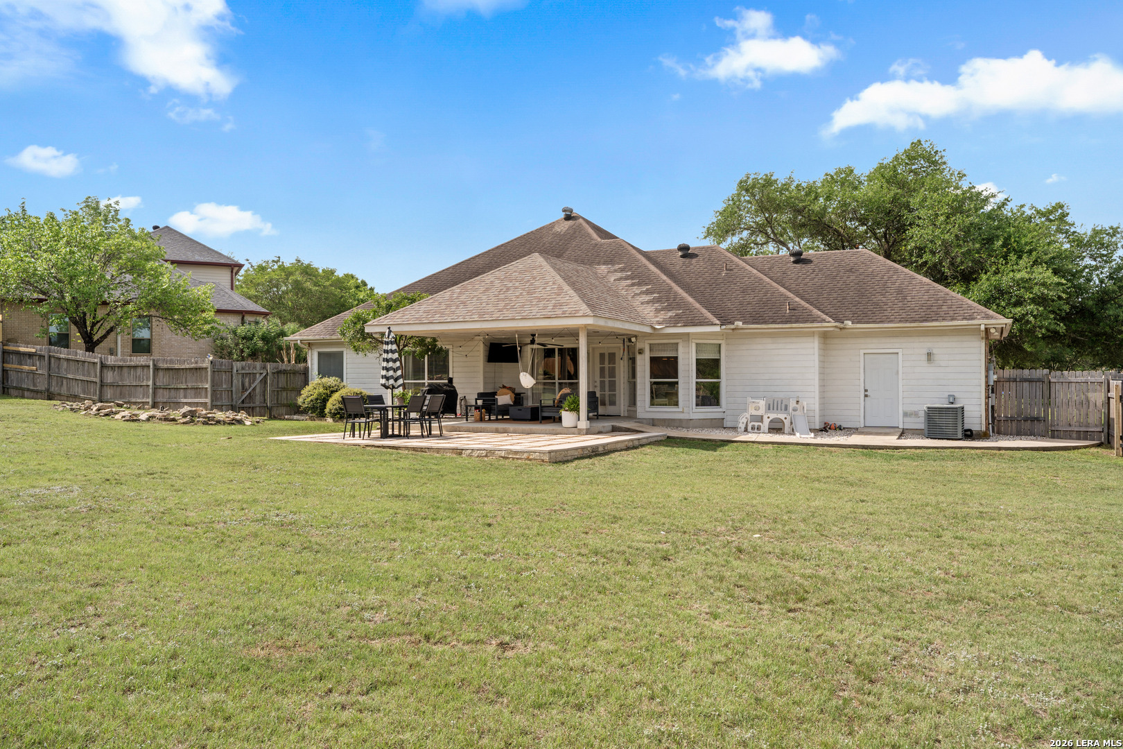 29314 Sumpter Drive Fair Oaks Ranch, TX 78015 - Photo 35 of 44 a front view of a house with swimming pool having outdoor seating