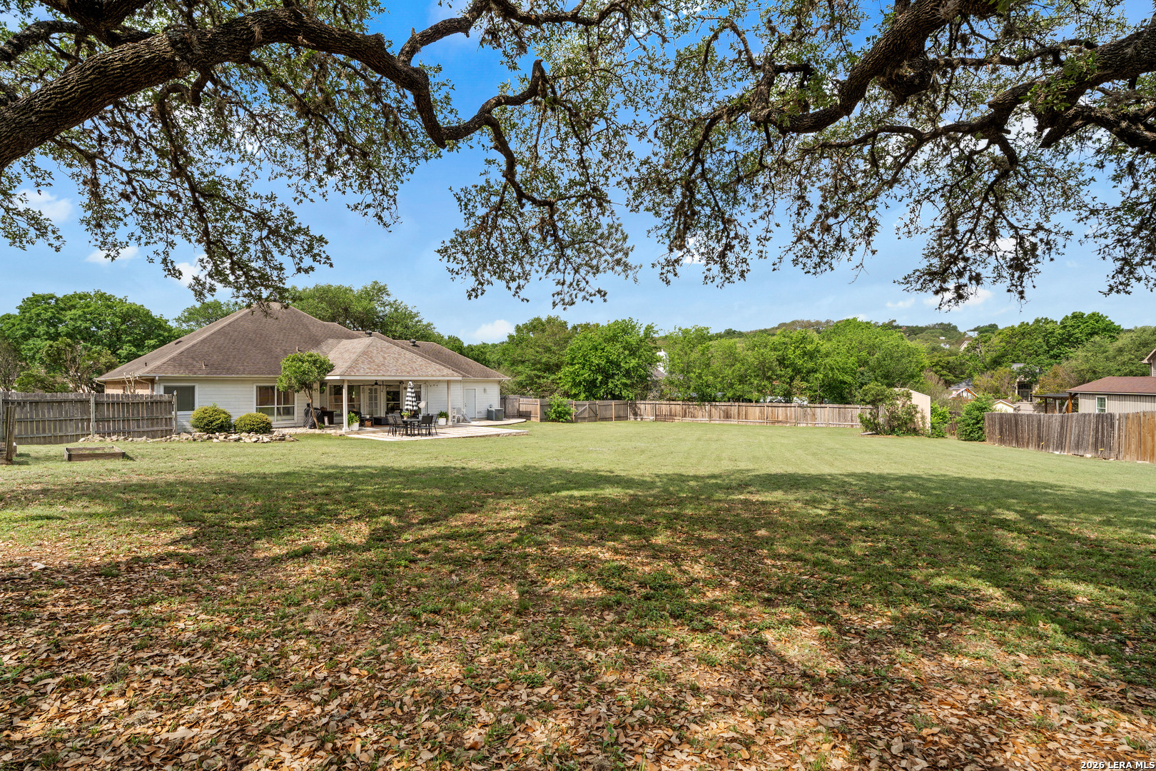 29314 Sumpter Drive Fair Oaks Ranch, TX 78015 - Photo 38 of 44 a view of house with garden space and trees
