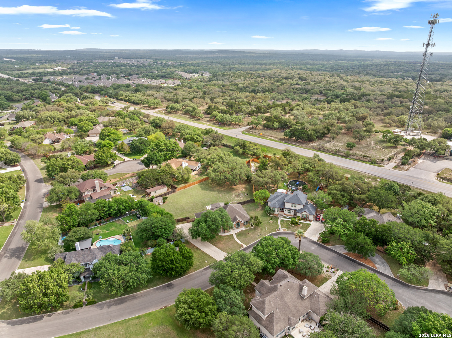 29314 Sumpter Drive Fair Oaks Ranch, TX 78015 - Photo 42 of 44 an aerial view of residential houses with outdoor space and trees