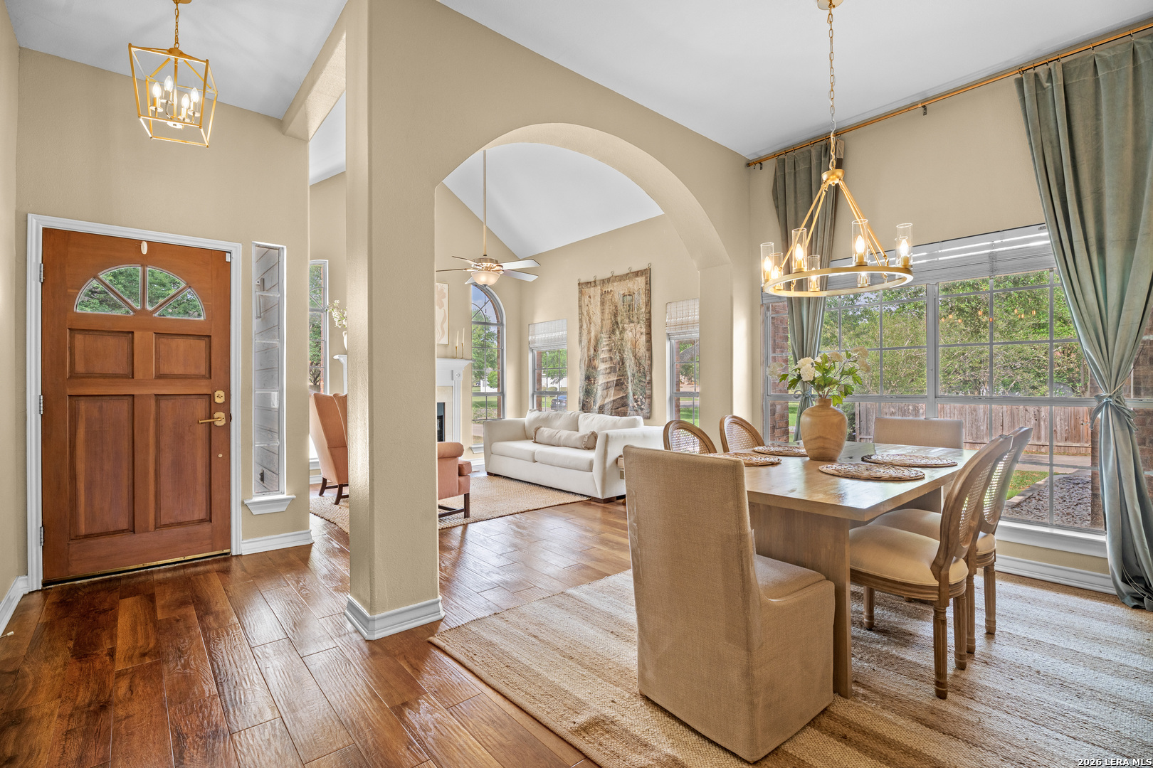 29314 Sumpter Drive Fair Oaks Ranch, TX 78015 - Photo 6 of 44 a view of a dining room with furniture wooden floor and chandelier
