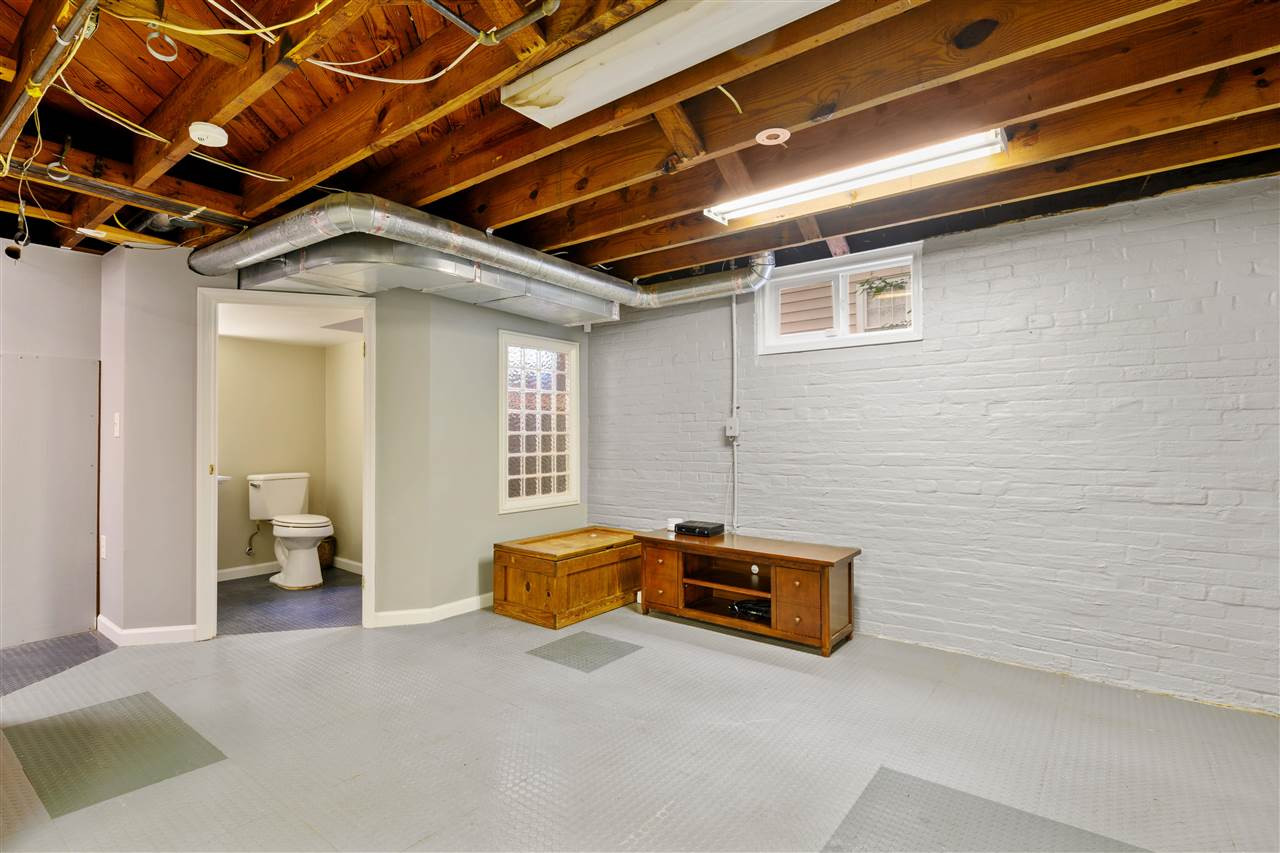 2618 Van Dyke Avenue Raleigh, NC 27607 - Photo 26 of 30 Well-lit with sturdy floors, the basement has ample room and even a full bathroom. Basement
