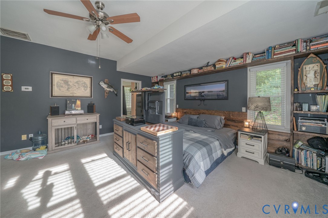 12700 Coalboro Road Chesterfield, VA 23838 - Photo 32 of 50 Carpeted room featuring a ceiling fan, built-in sh