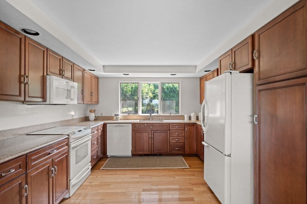 22 Little Neck Road Ipswich, MA 01938 - Photo 14 of 37 a large kitchen with stainless steel appliances granite countertop a refrigerator and a sink
