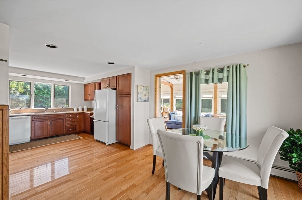 22 Little Neck Road Ipswich, MA 01938 - Photo 15 of 37 a view of a dining room with furniture window and wooden floor