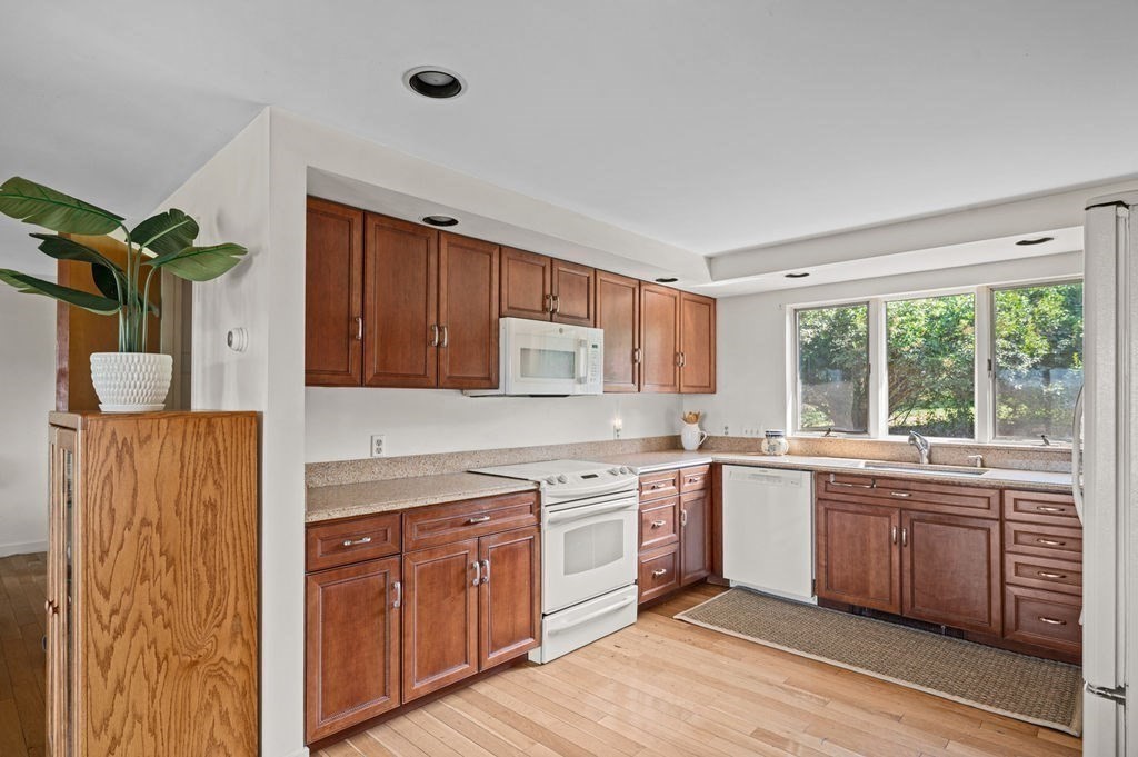 22 Little Neck Road Ipswich, MA 01938 - Photo 17 of 37 a kitchen with a sink window and cabinets