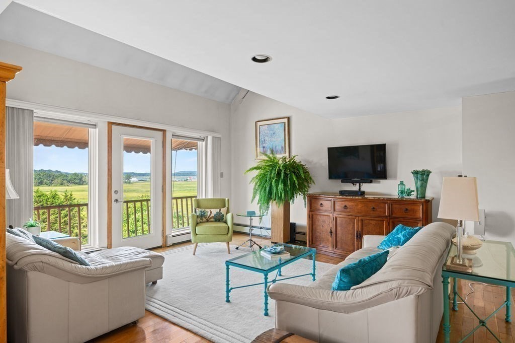 22 Little Neck Road Ipswich, MA 01938 - Photo 18 of 37 a living room with furniture and a flat screen tv