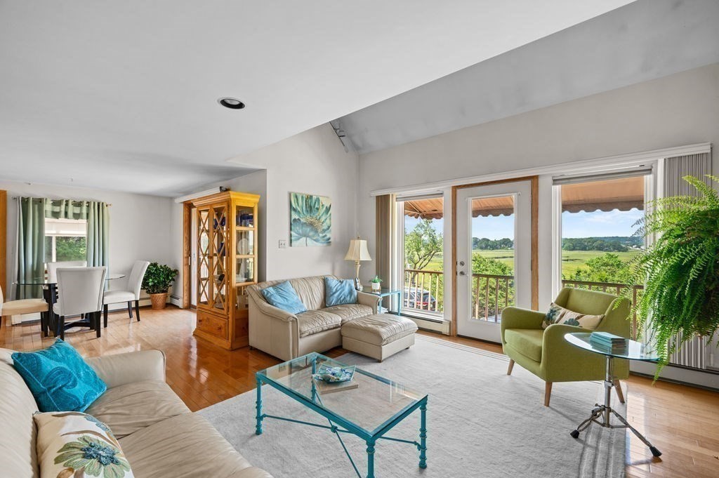 22 Little Neck Road Ipswich, MA 01938 - Photo 19 of 37 a living room with furniture and a large window