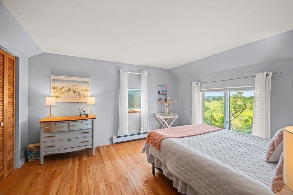 22 Little Neck Road Ipswich, MA 01938 - Photo 28 of 37 a bedroom with a bed and a window