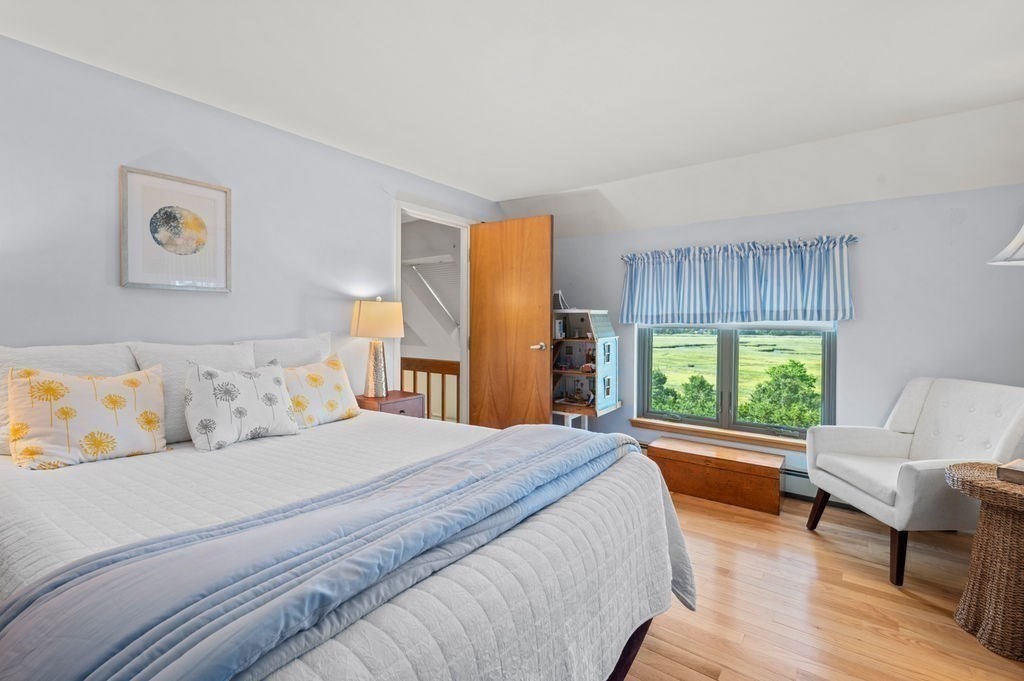 22 Little Neck Road Ipswich, MA 01938 - Photo 30 of 37 a bedroom with a bed and a couch