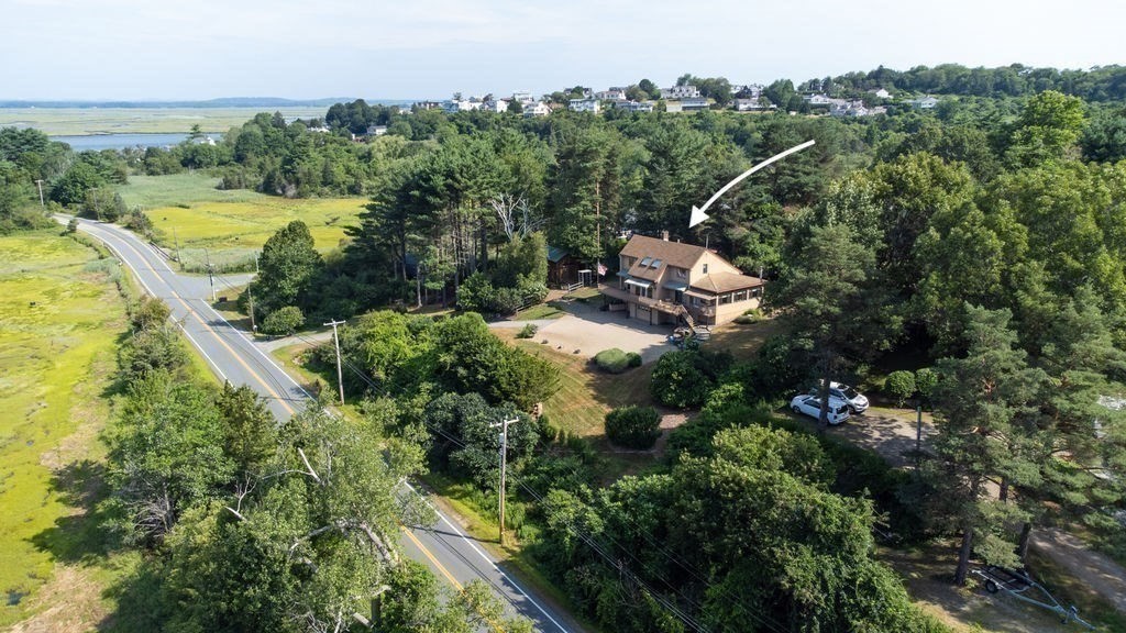 22 Little Neck Road Ipswich, MA 01938 - Photo 6 of 37 a aerial view of a house with a yard and lake view