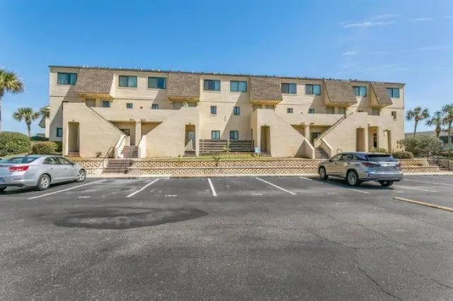 a view of parking with cars parked