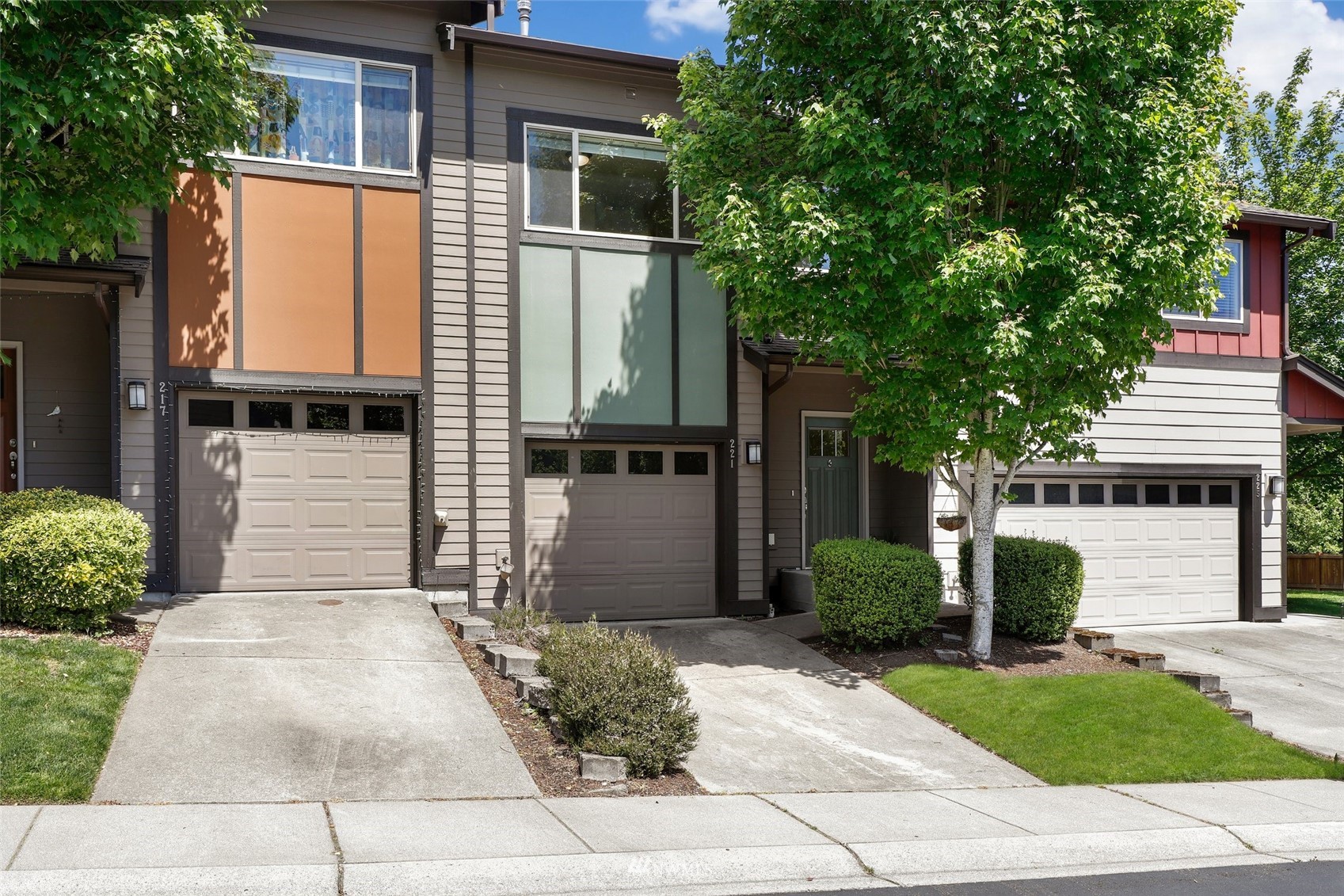 221 164th Place Southeast Bothell, WA 98012 - Photo 1 of 30 a front view of a house with a garden