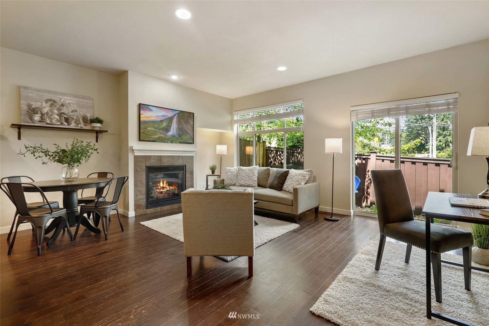 221 164th Place Southeast Bothell, WA 98012 - Photo 13 of 30 a living room with furniture a large window and a fireplace