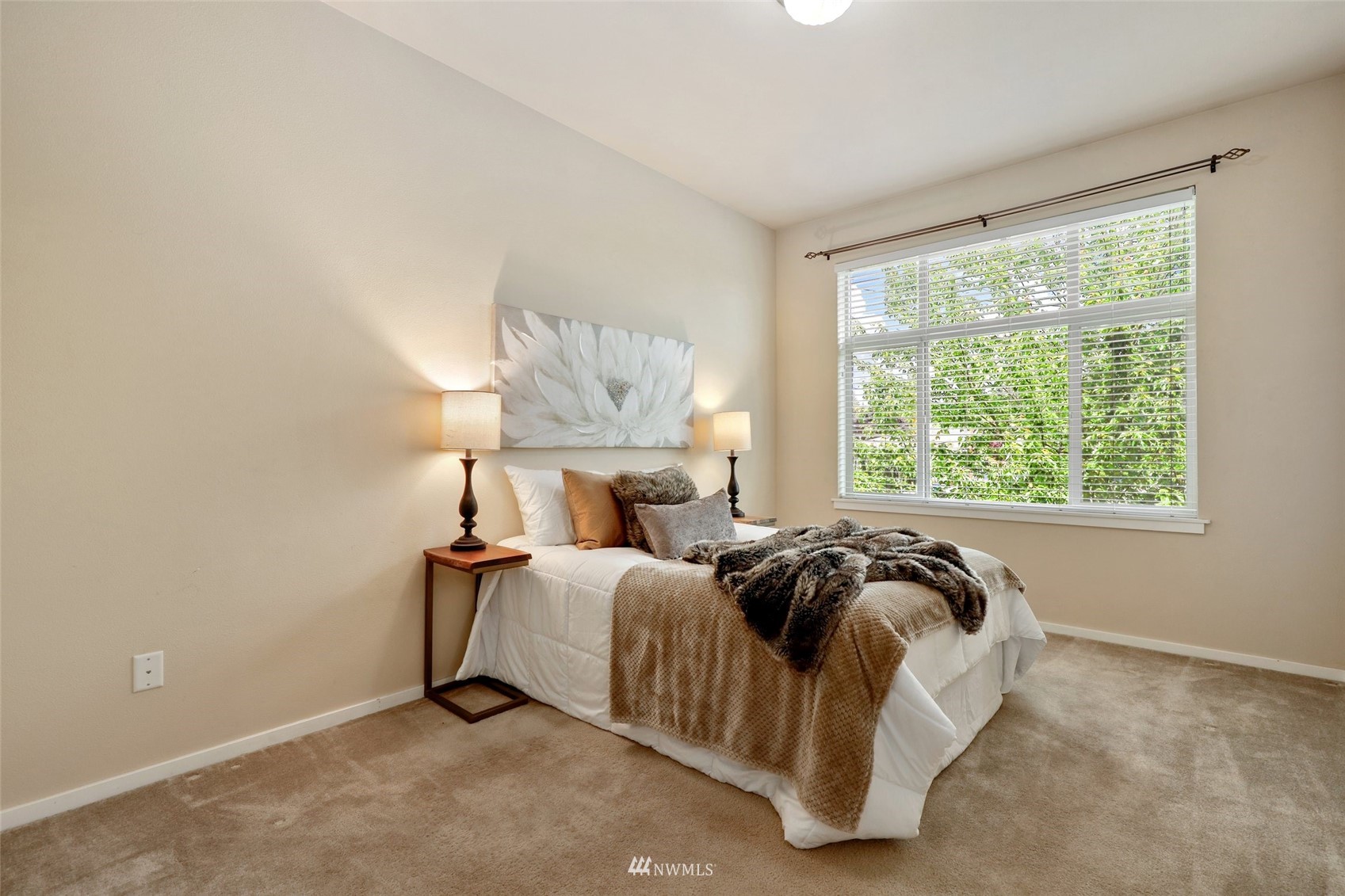 221 164th Place Southeast Bothell, WA 98012 - Photo 18 of 30 a bed sitting in a bedroom next to a window