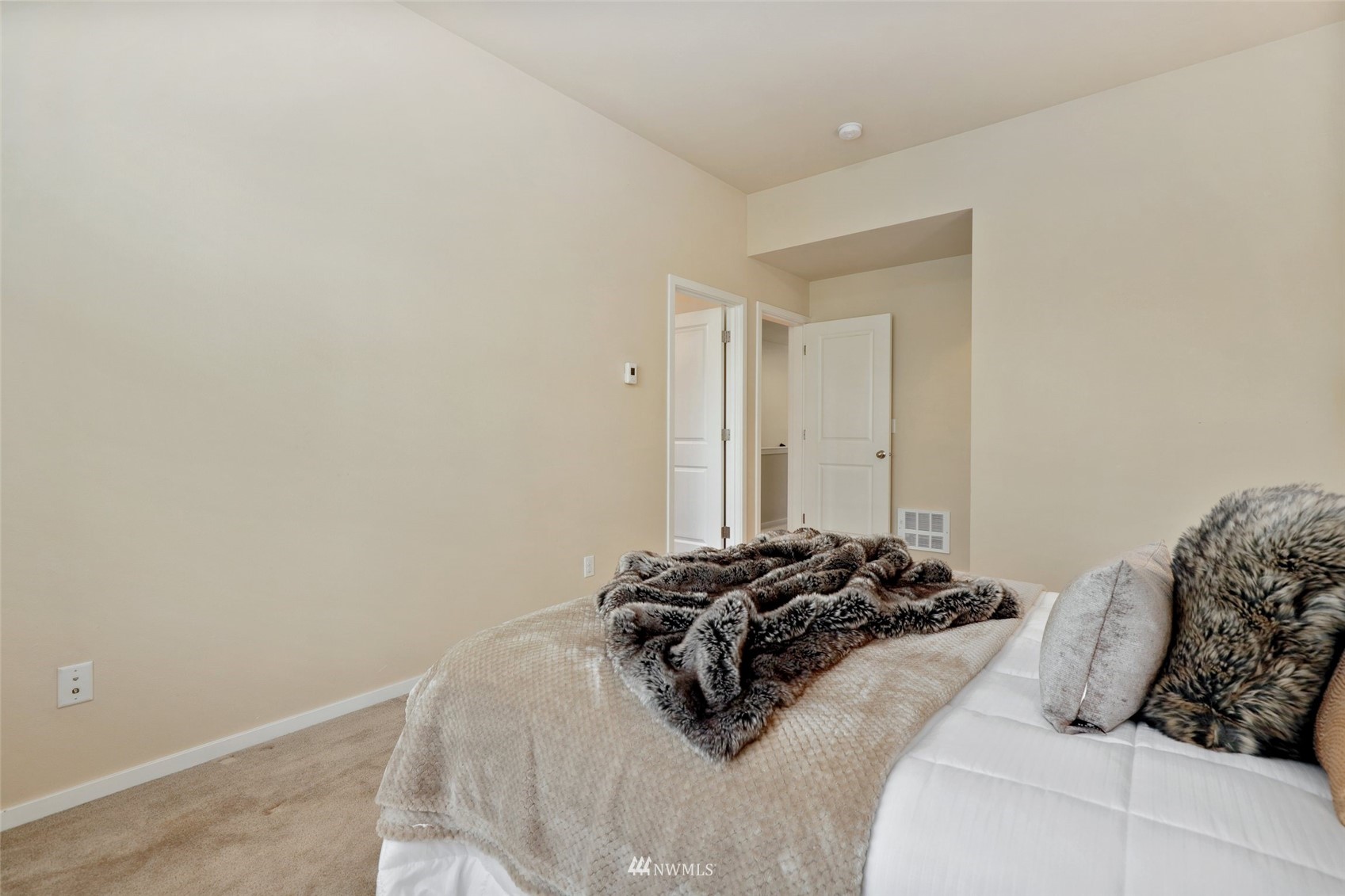 221 164th Place Southeast Bothell, WA 98012 - Photo 19 of 30 a bed sitting in a bedroom next to a window