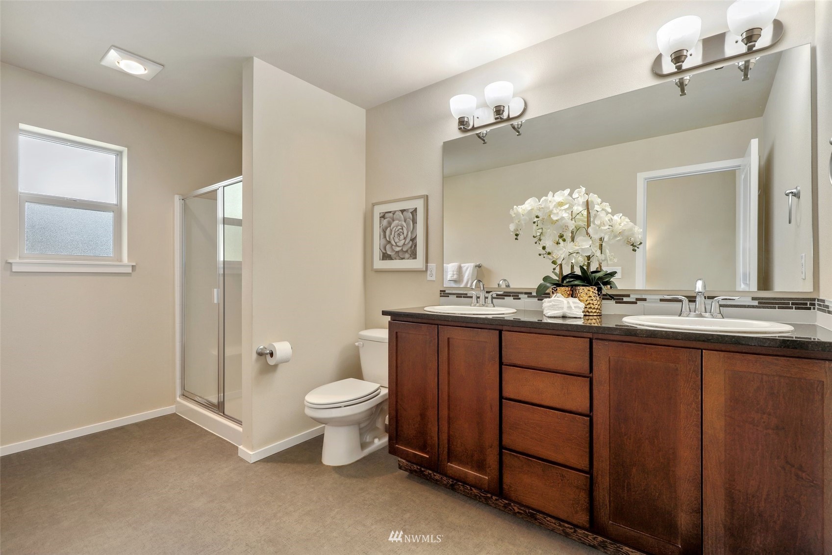 221 164th Place Southeast Bothell, WA 98012 - Photo 20 of 30 a bathroom with a granite countertop sink a toilet and a mirror