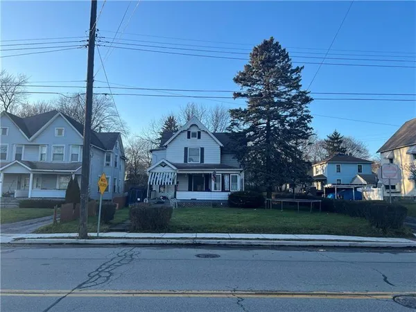 front view of a house with a big yard