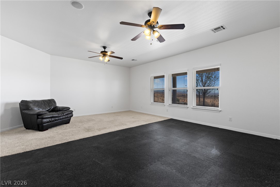 575 Gann Avenue Logandale, NV 89021 - Photo 30 of 75 A versatile open space with contrasting flooring and natural light.