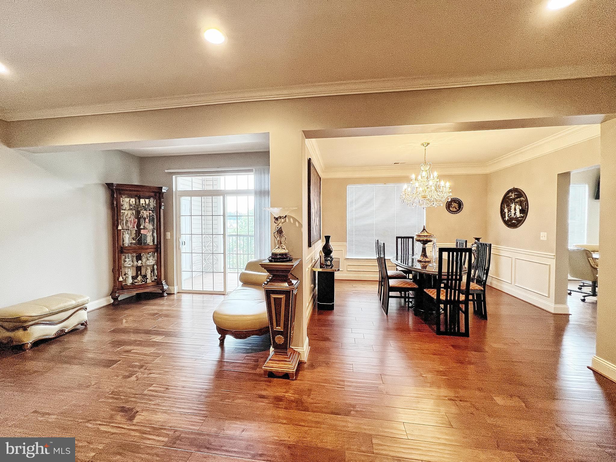 605 Quarry View Court, Unit 307 Reisterstown, MD 21136 - Photo 11 of 30 a living room with furniture and wooden floor
