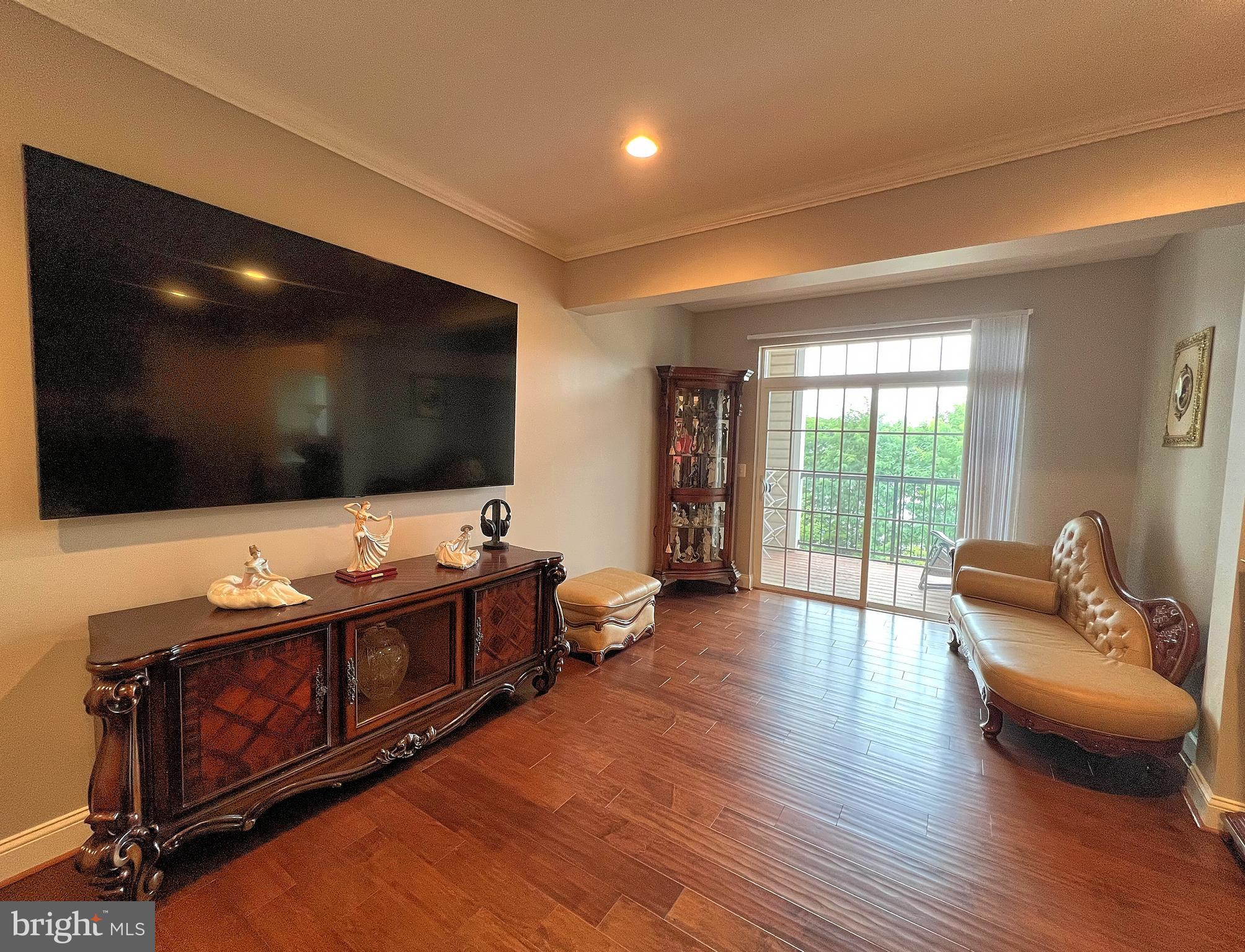 605 Quarry View Court, Unit 307 Reisterstown, MD 21136 - Photo 12 of 30 a living room with furniture and a flat screen tv