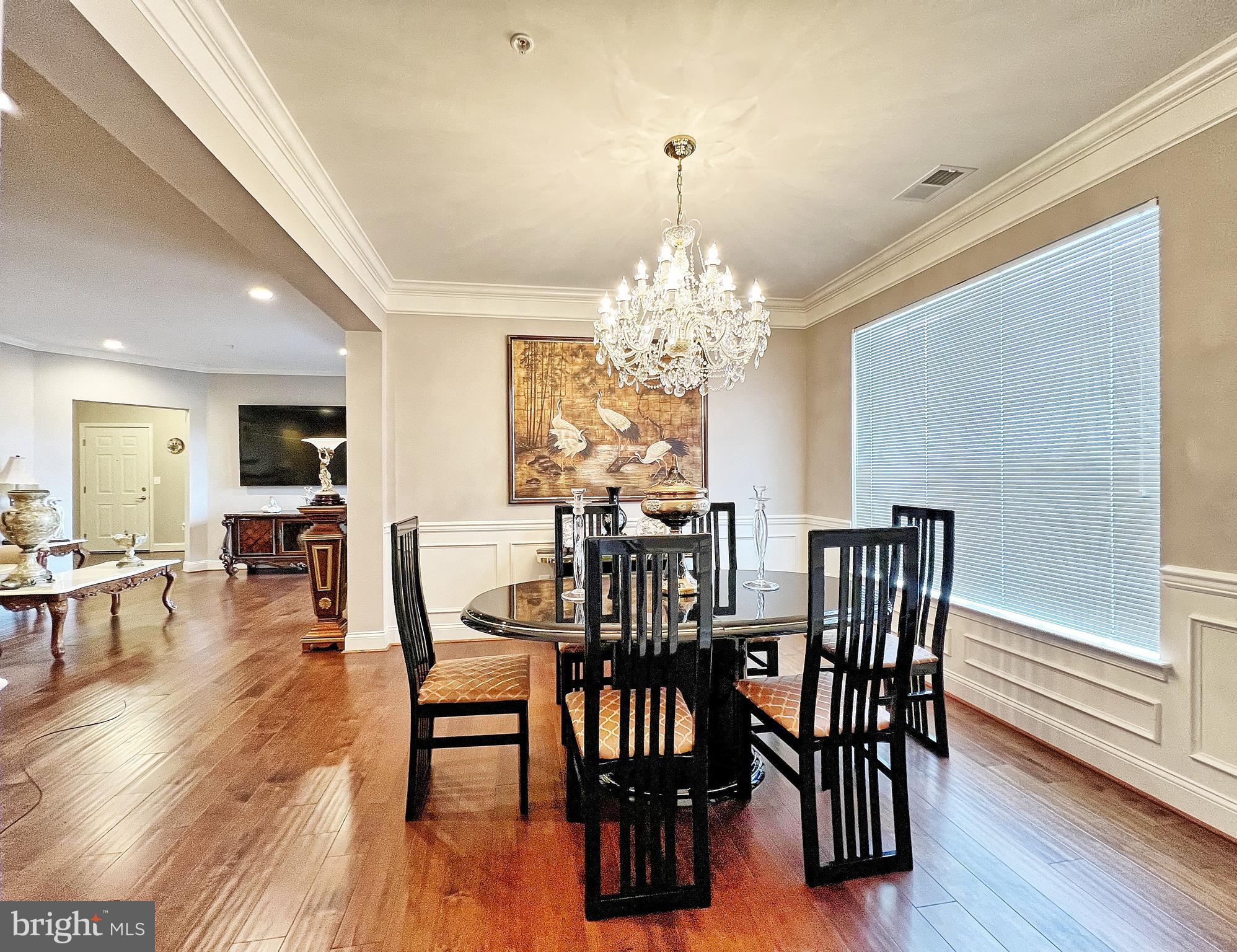 605 Quarry View Court, Unit 307 Reisterstown, MD 21136 - Photo 14 of 30 a view of a dining room with furniture window and wooden floor